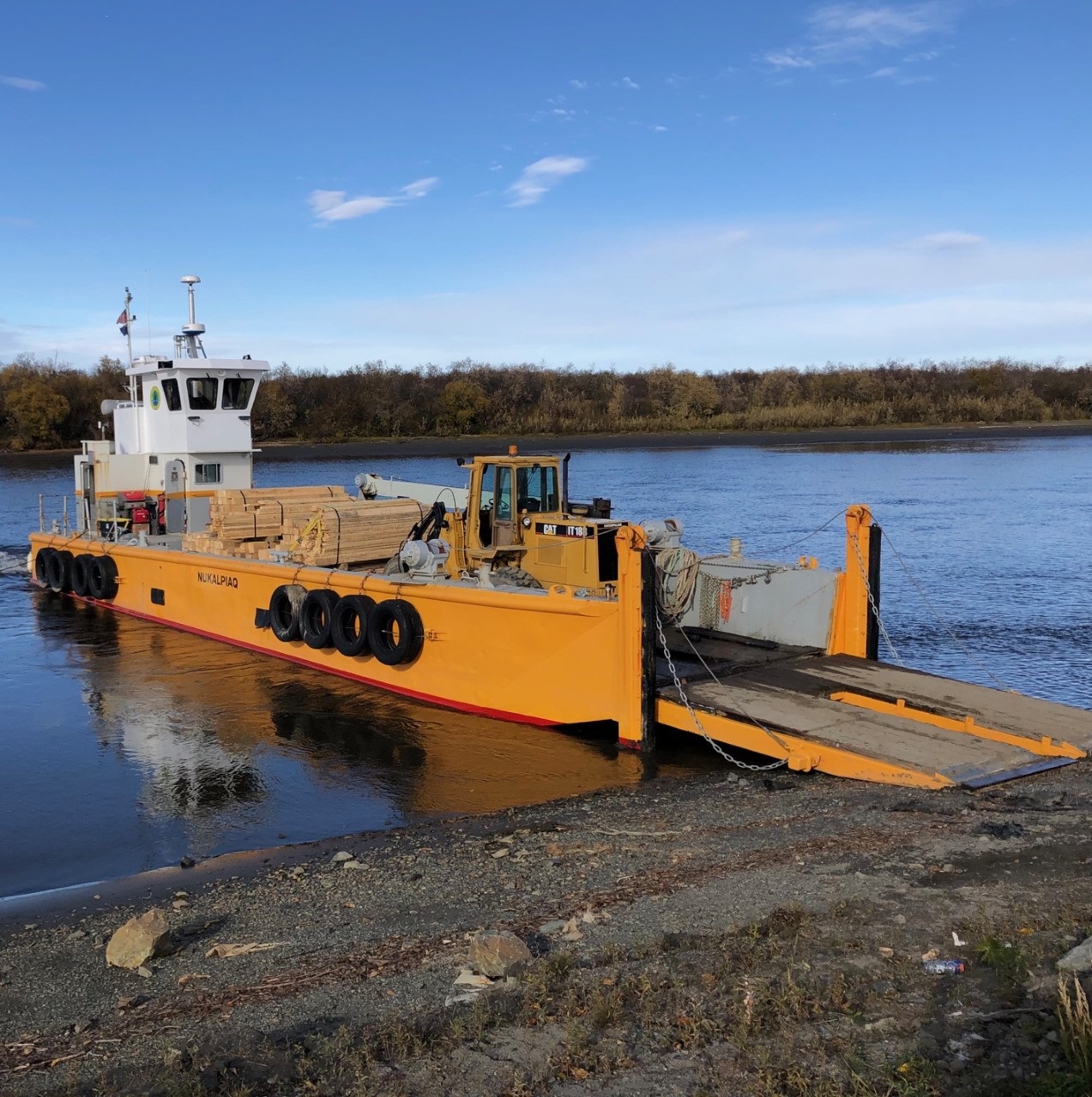 The Nukalpiaq delivering wood products along the Kuskokwim River to support the economy of the Native Village of Napaimute in Alaska.